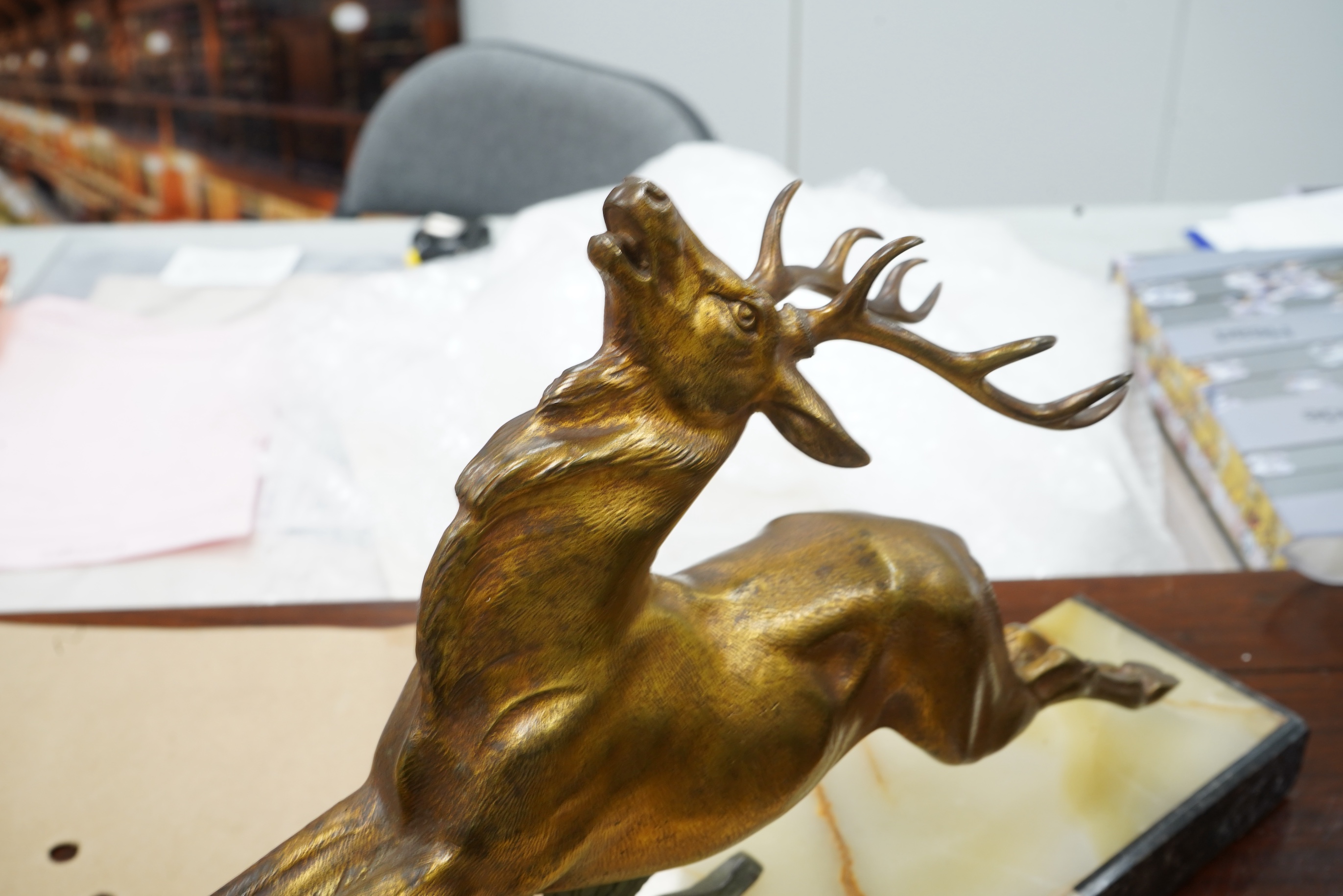 A French Bronze stag attributed to E Guy, on onyx base, 53cm wide x 33cm high